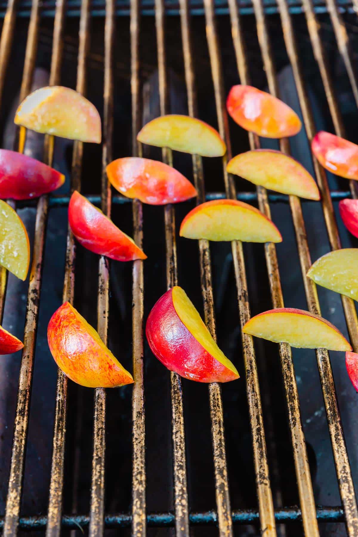 Peach slices on the grill.