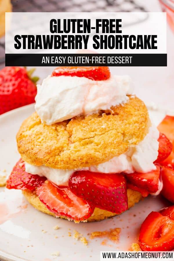 An individual gluten-free strawberry shortcake on a plate topped with homemade whipped cream and a strawberry slice with a text overlay.