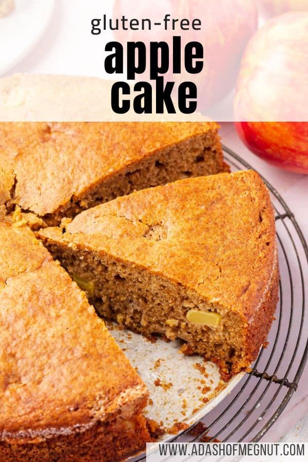 A closeup of a slice of gluten-free apple cake cut from a larger cake on top of a round cooling rack with a text overlay.