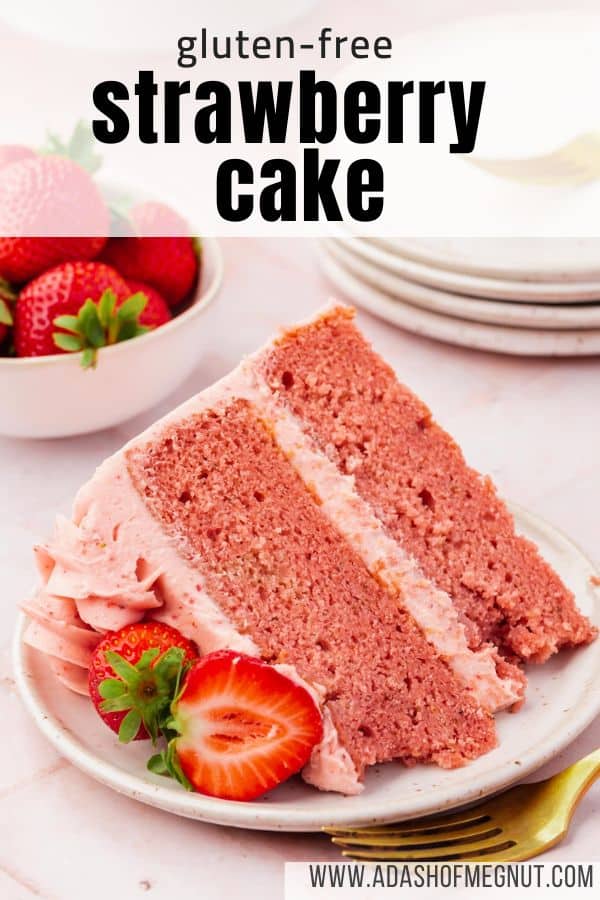 A slice of strawberry cake with strawberry frosting on a dessert plate with fresh strawberry halves and a gold fork with a text overlay.