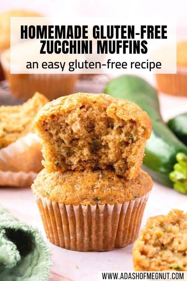 A gluten-free zucchini muffin with a bite taken out of it stacked on top of another zucchini muffin.