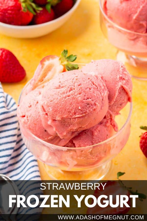 A glass bowl with scoops of strawberry frozen yogurt in it.