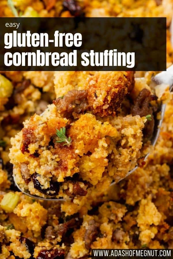 A large spoon of gluten-free cornbread stuffing over a larger portion of stuffing.