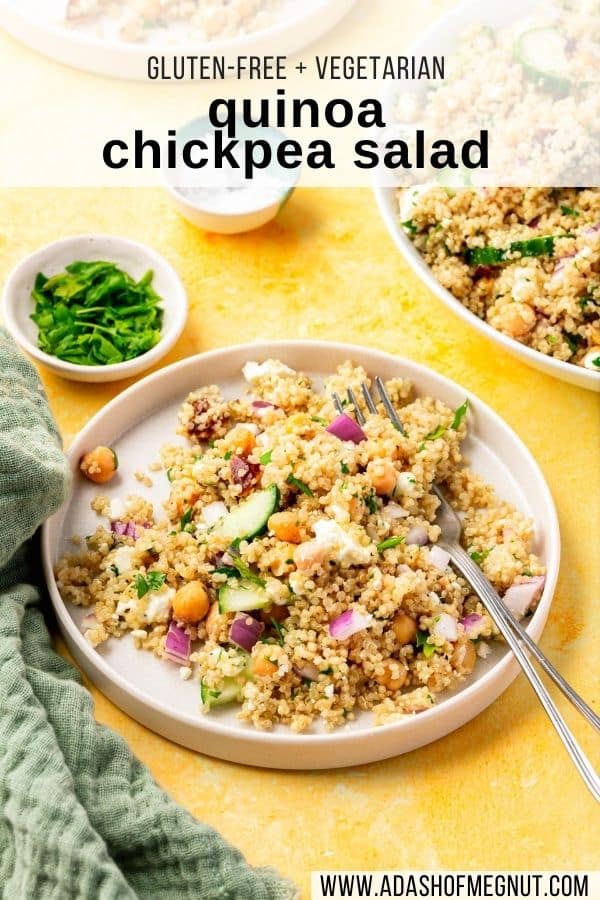 A salad plate with a cold quinoa chickpea salad with a fork digging into it next to a bowl of parsley and a bowl of salt.