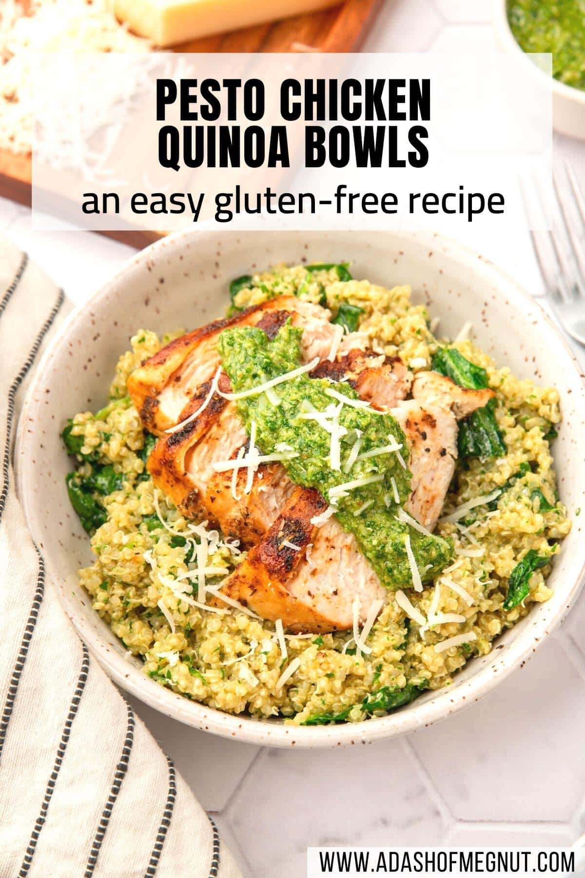 A bowl of pesto chicken quinoa bowls topped with pesto and shredded parmesan with a text overlay over the image.