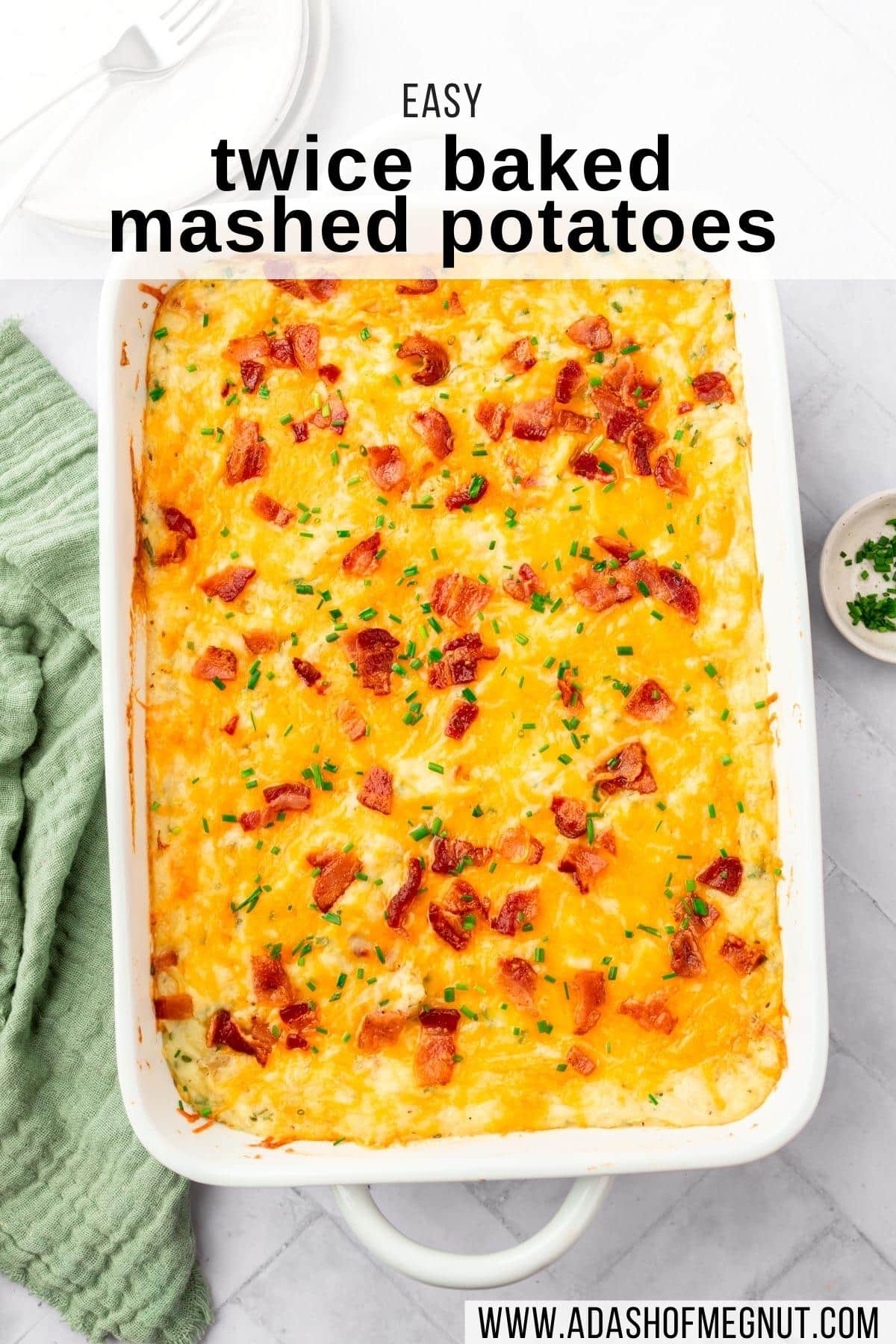 A closeup of a casserole dish filled with twice baked mashed potatoes topped with bacon and cheddar cheese with a text overlay over the image.