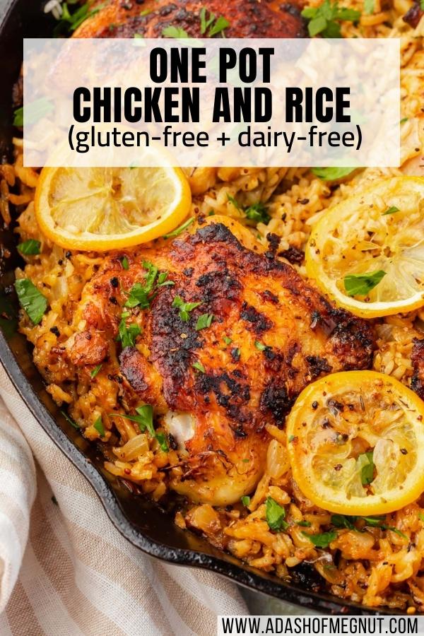 A close up of roasted chicken thighs on top of a bed of seasoned white rice and topped with charred lemon slices and fresh parsley in a cast iron skillet.