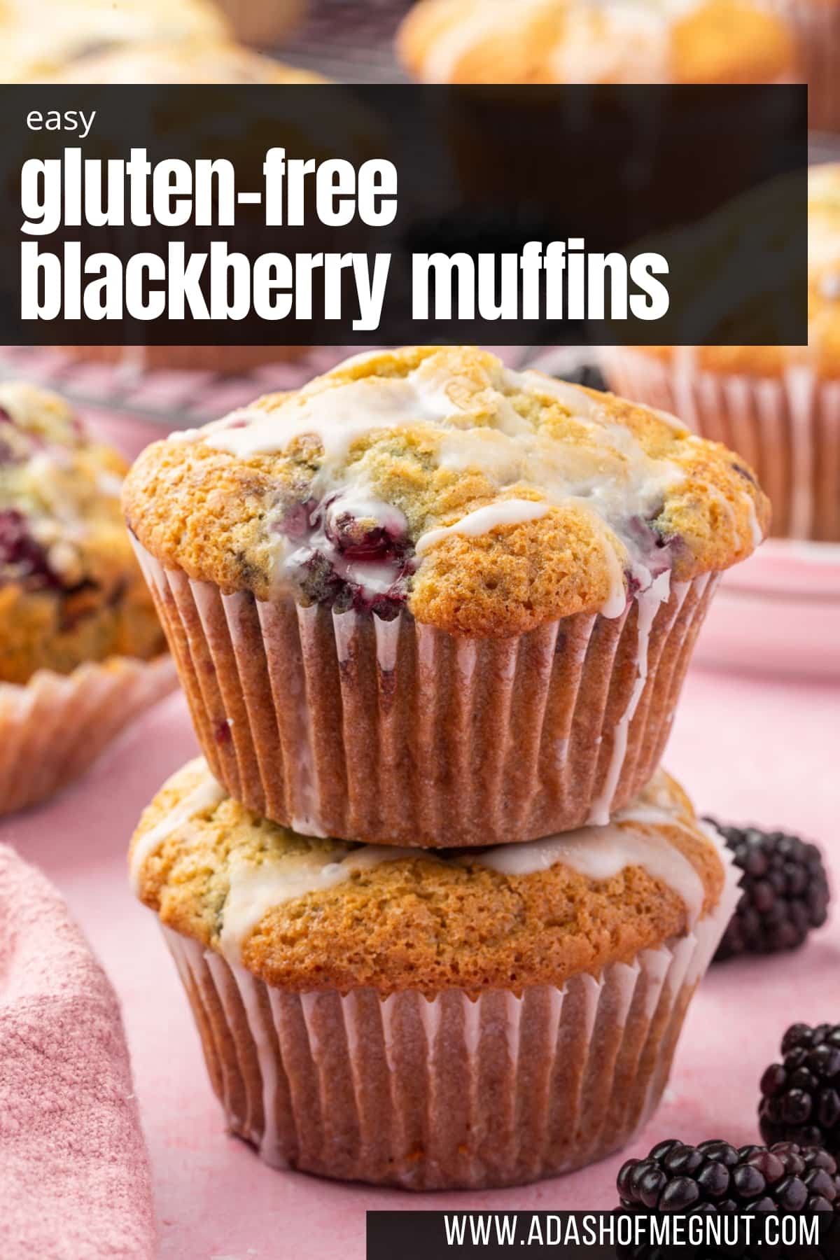 A stack of two lemon glazed blackberry muffins with more muffins in the background.