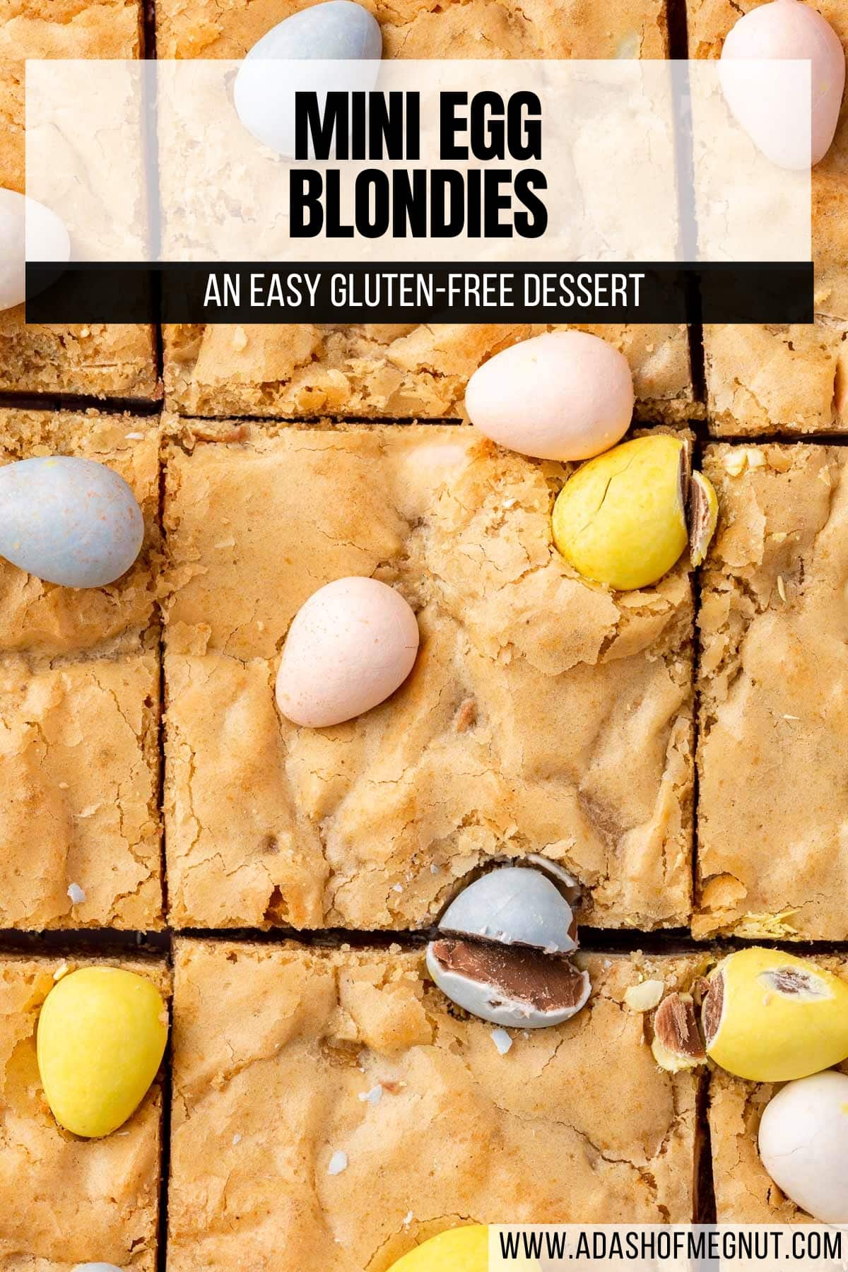 An overhead view of a slab of gluten-free blondies with mini chocolate eggs on top that has been cut into 9 equal pieces.