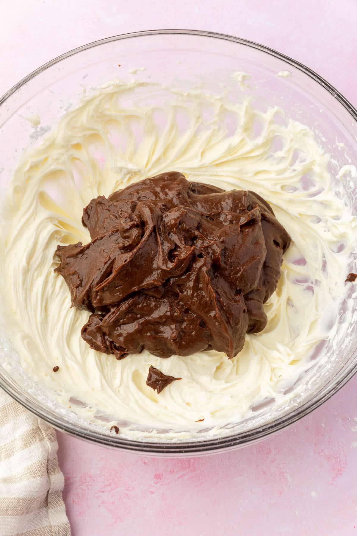 A cream cheese mixture topped with chocolate pudding.