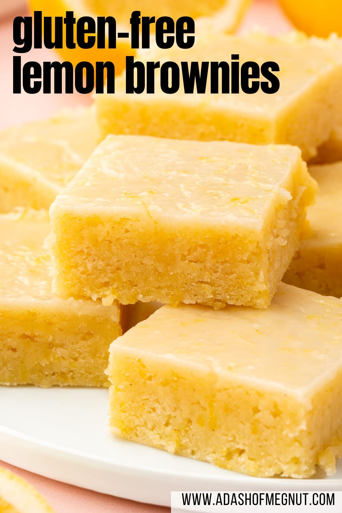 A stack of gluten free lemon brownies on a white dessert plate.
