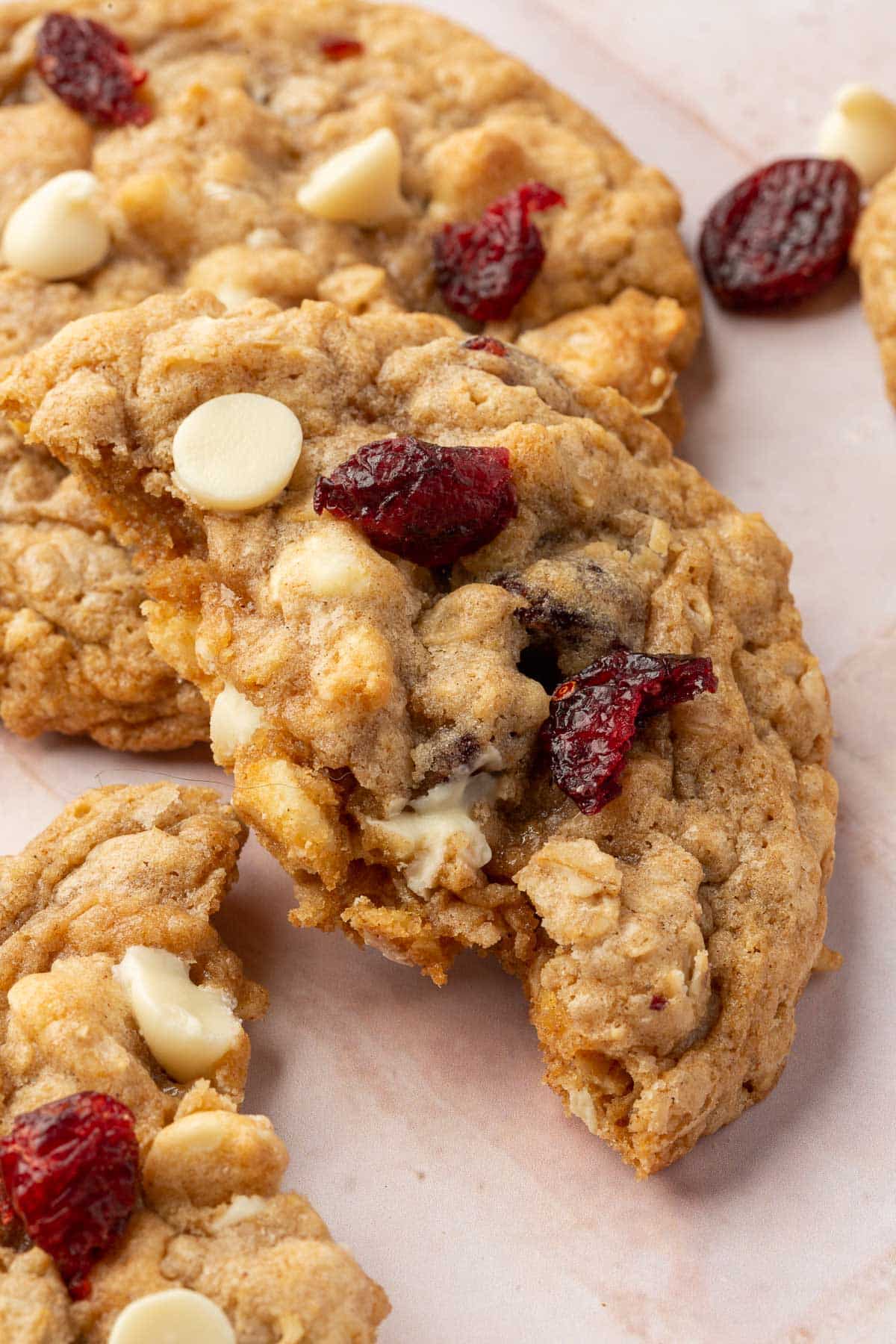 A gluten-free oatmeal craisin cookie that has been ripped in half.