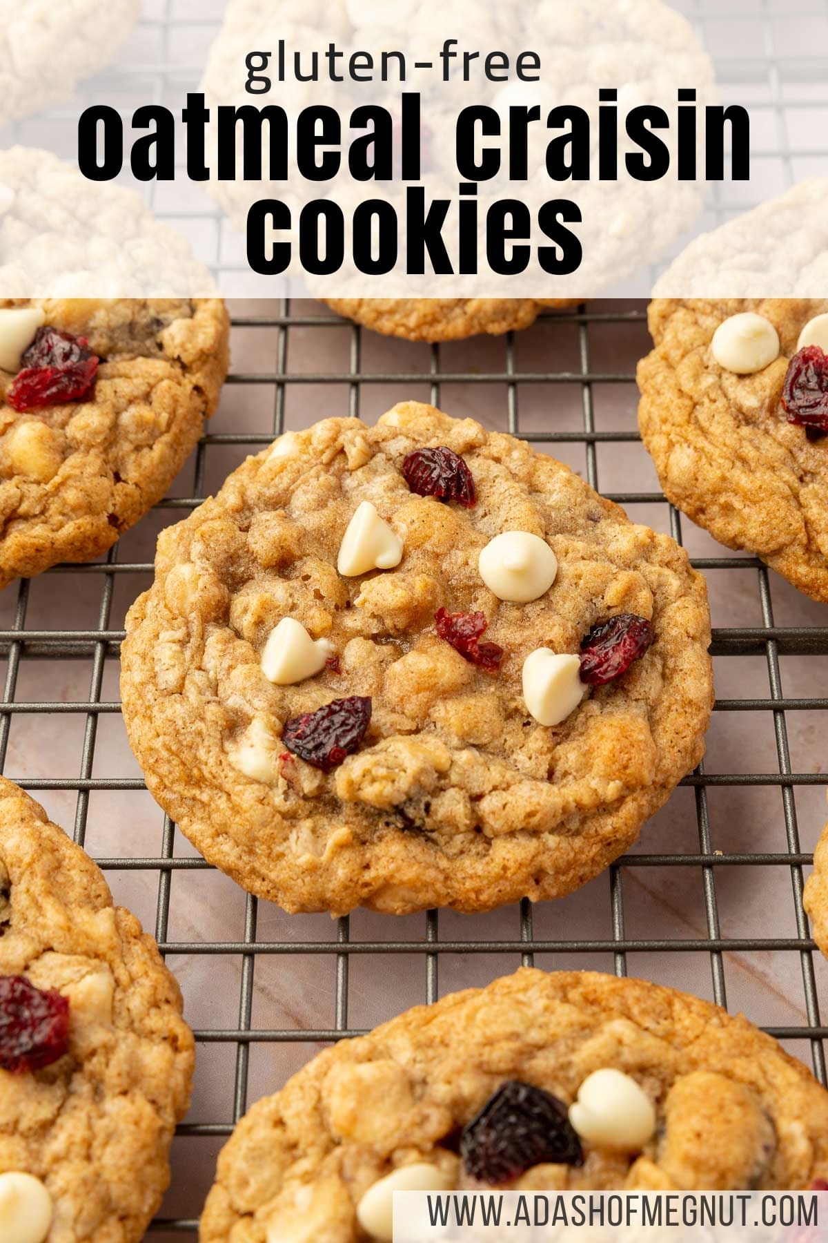 Gluten-free oatmeal white chocolate cranberry cookies cooling on a wire rack.