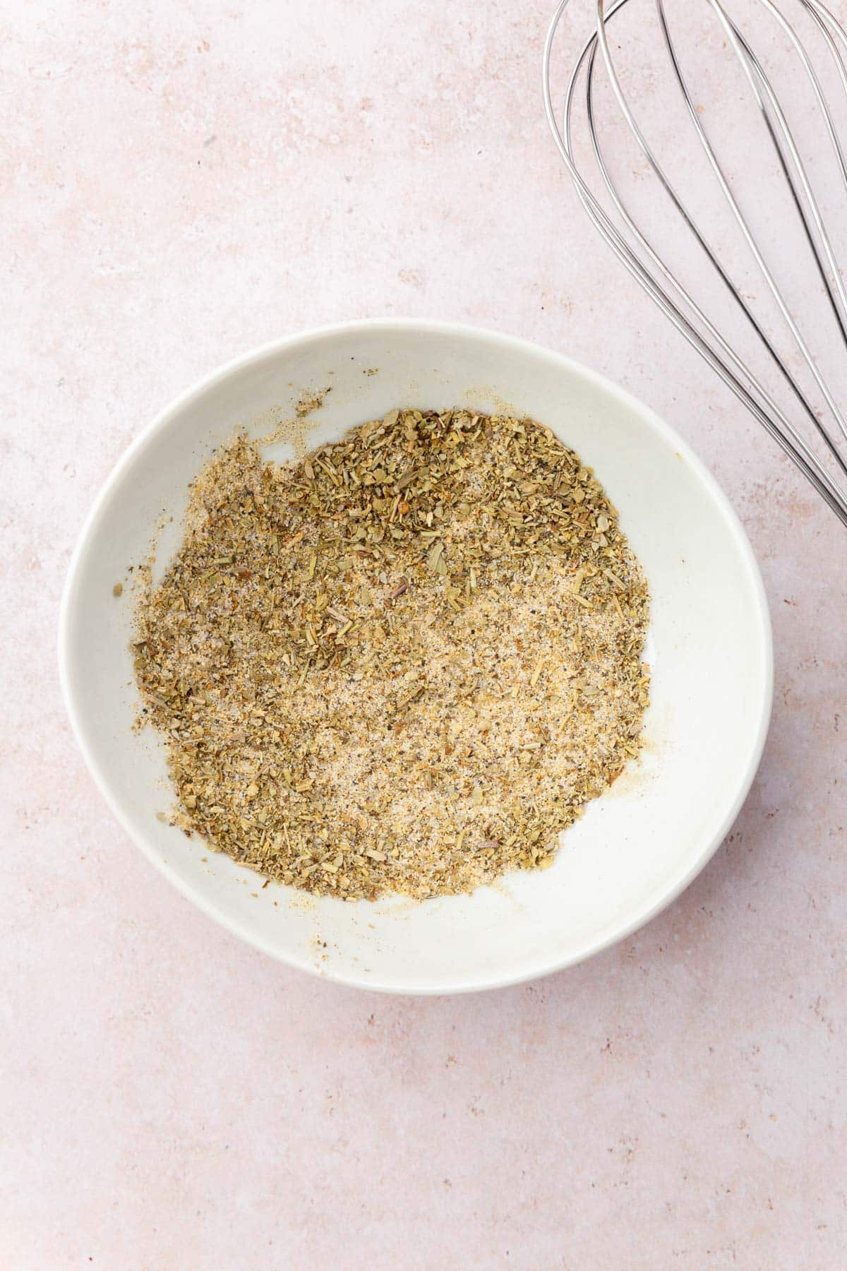 A small bowl of spices that have been mixed together.