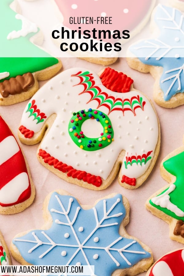 A close up of festive Christmas cookies decorated as ugly Christmas sweaters, snowflakes, Christmas trees, candy canes and polka dot mittens.