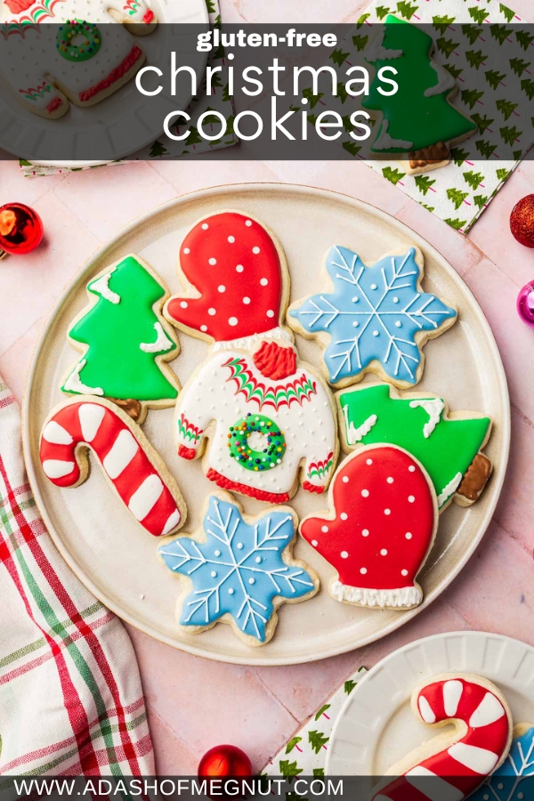 A round platter filled with Christmas cookies decorated as Christmas trees, candy canes, mittens, ugly sweaters and snowflakes with royal icing.