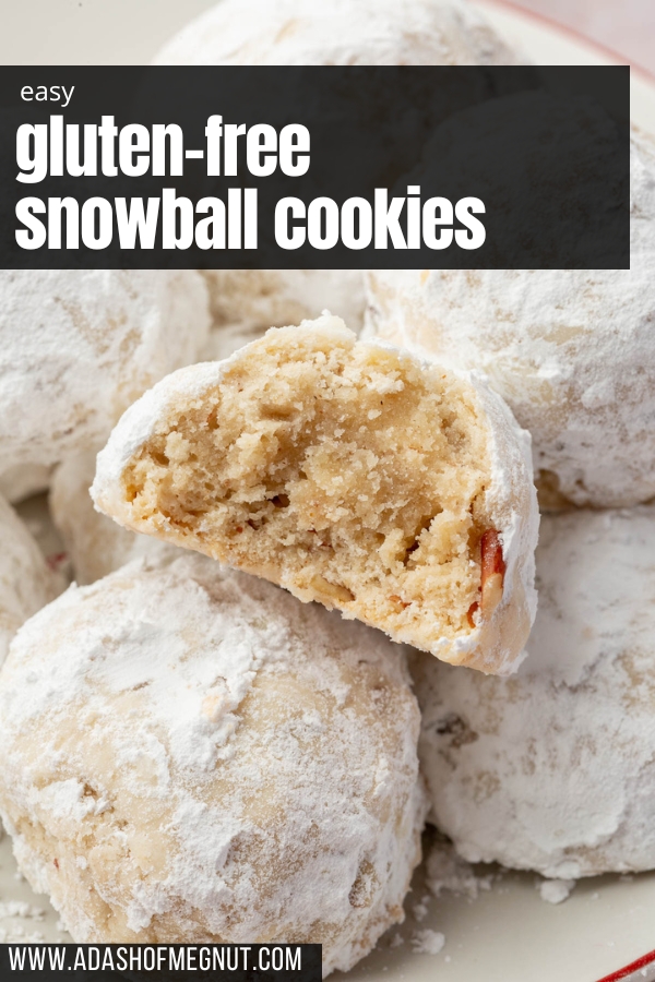 A mound of gf snowball cookies on a plate with the front snowball cookie cut in half to see the inside.