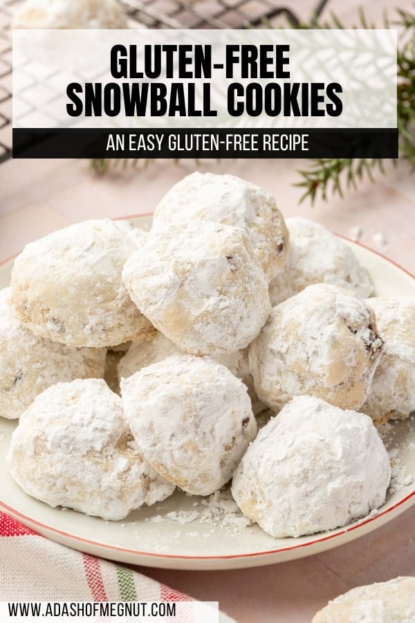 A mound of gluten free snowball cookies on a plate with a red rim.