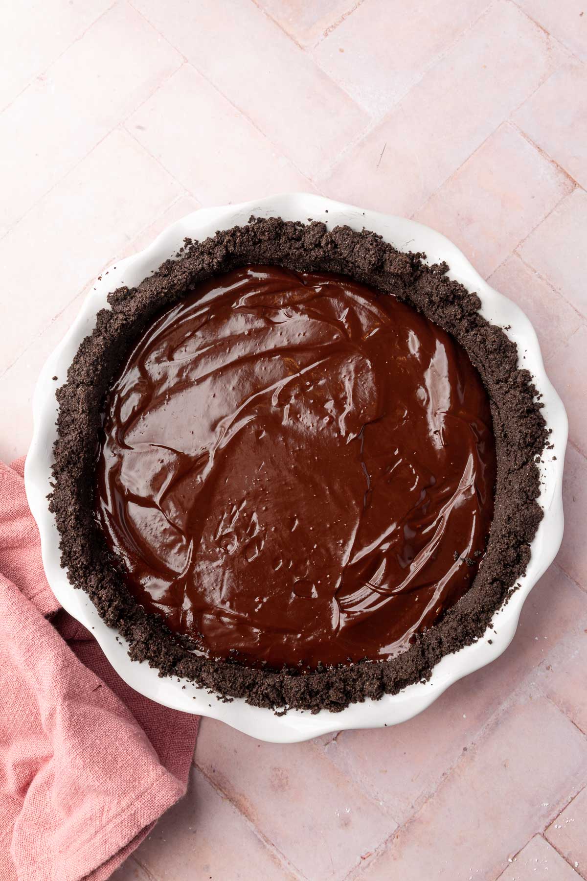 An overhead view of an Oreo pie crust filled with chocolate ganache.