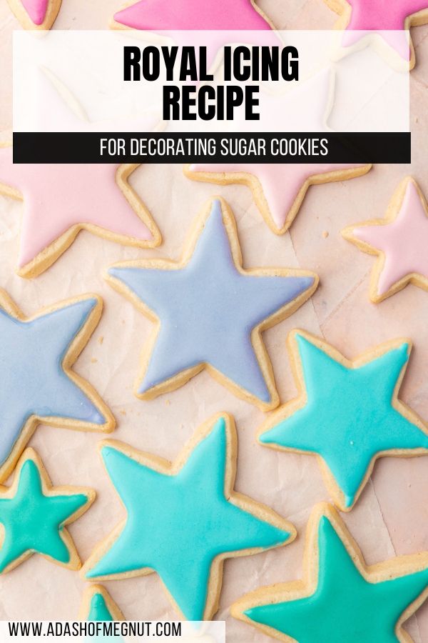 Star sugar cookies frosted with pink, purple, blue and green royal icing that has dried.