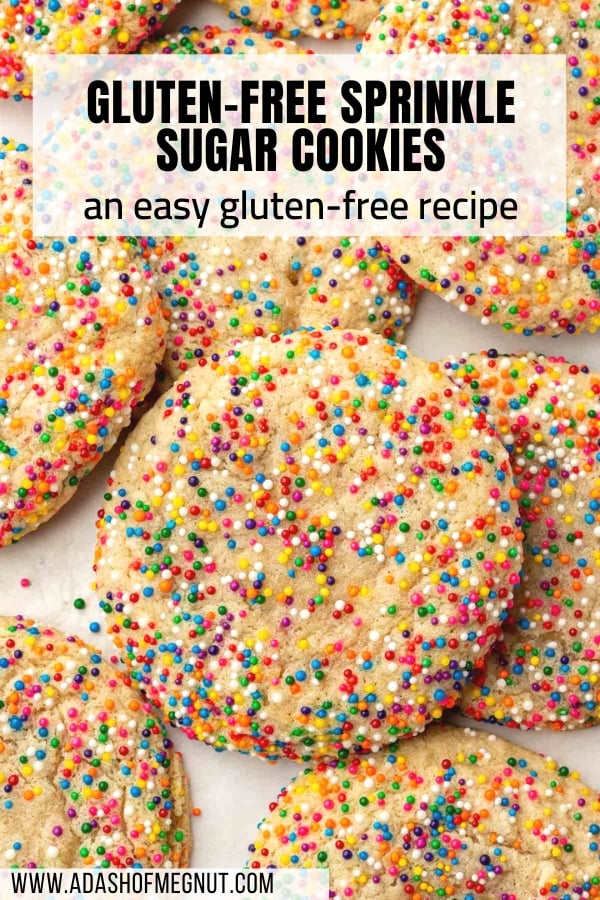 Gluten-free sprinkles sugar cookies overlapping each other on a piece of parchment paper.