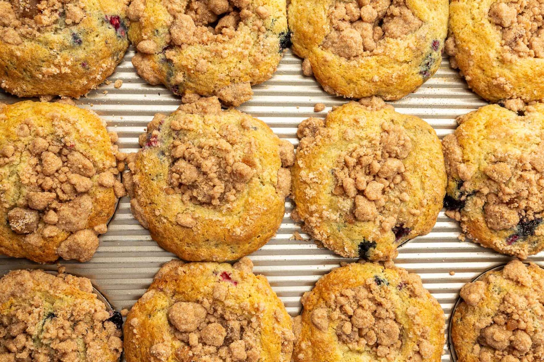 An overhead view of 12 gluten-free muffins with streusel baked in a muffin pan.