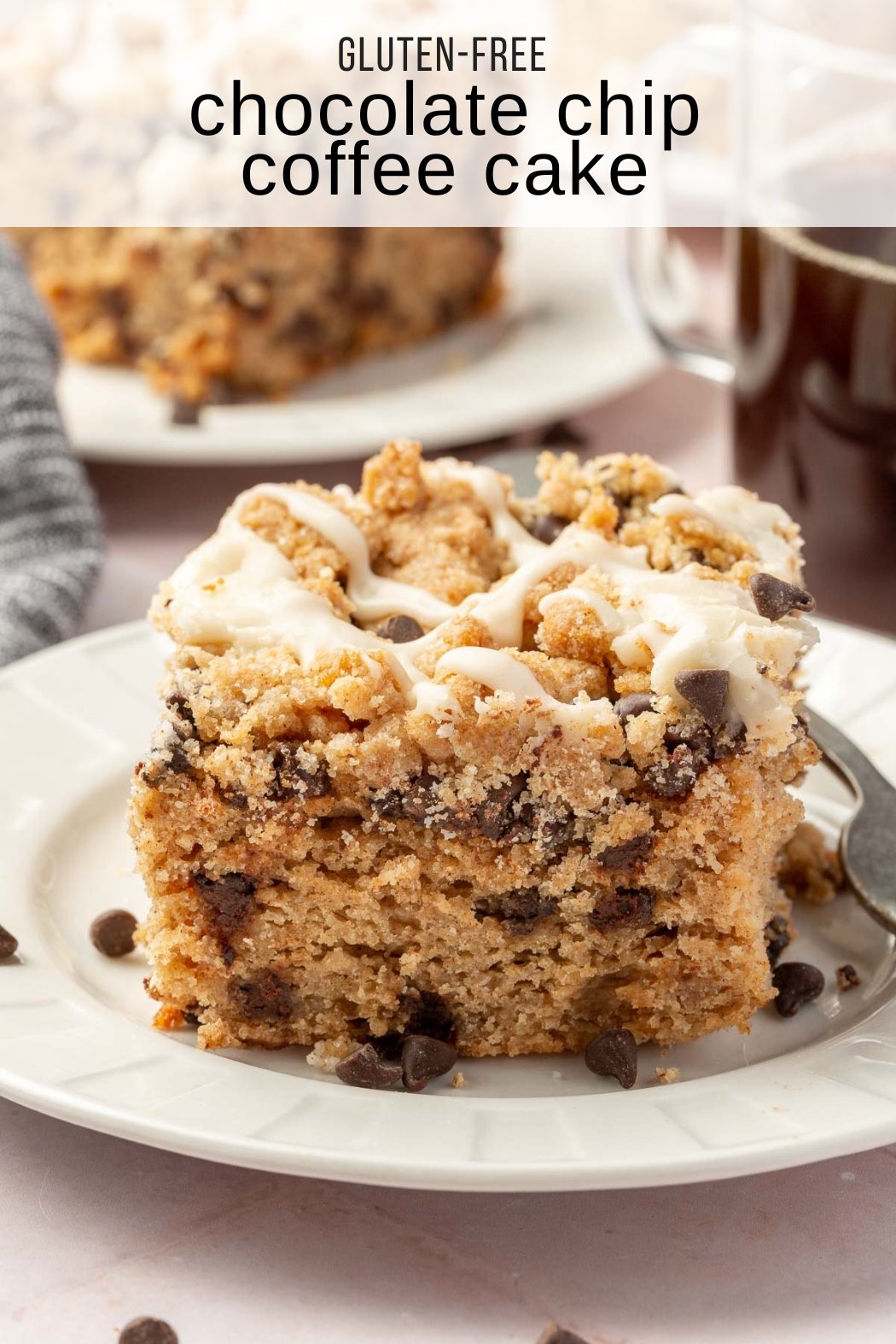 A slice of gluten-free mini coffee cake with chocolate chips on a dessert plate with coffee and additional coffee cake in the background.