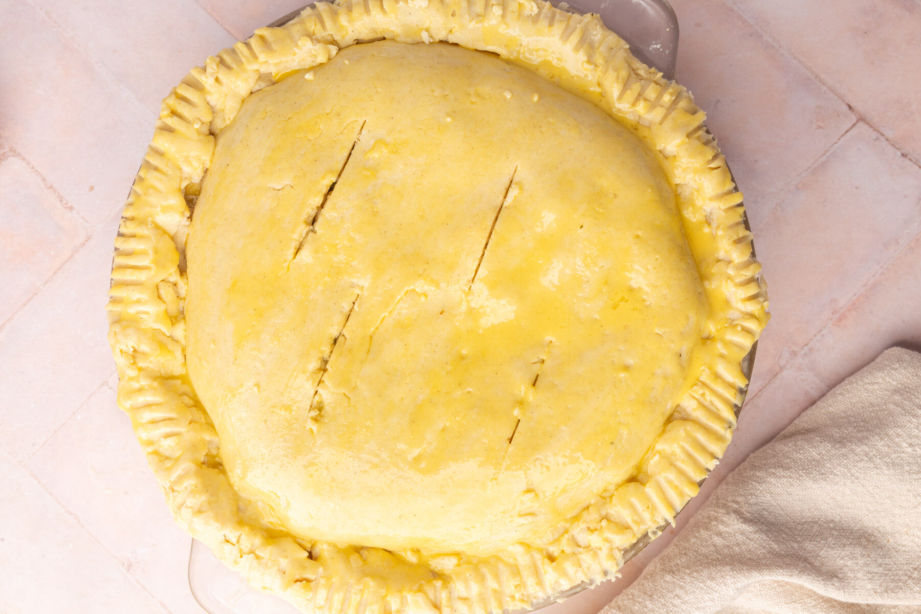 A pie with a yellow crust.
