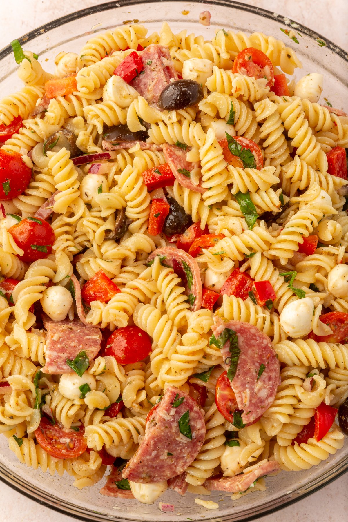 Image of finished gluten-free pasta salad in large mixing bowl.