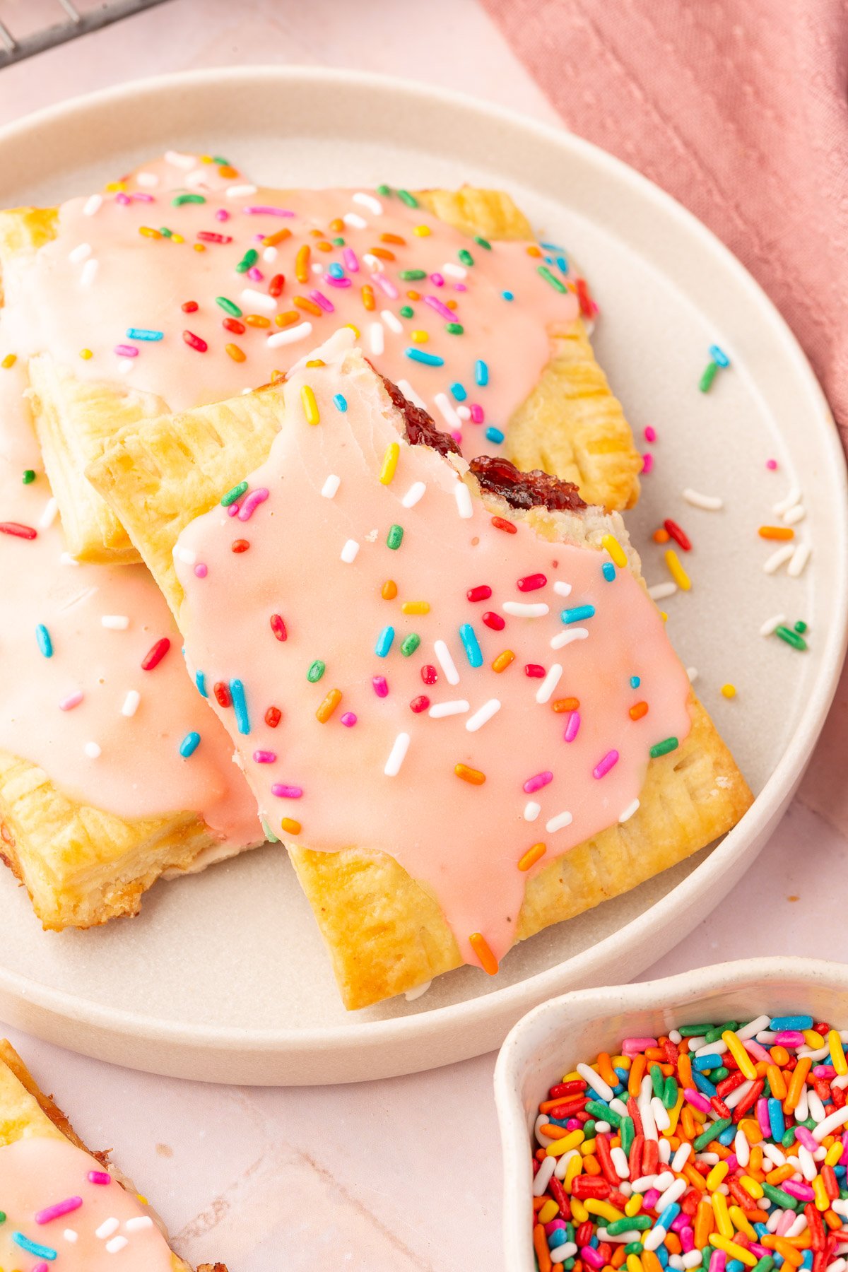 Close up image of finished gluten-free pop tarts with sprinkles on top.