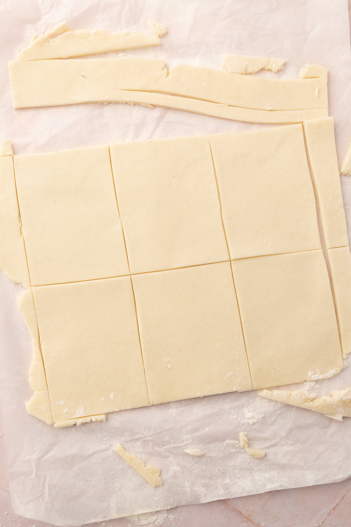 Image of pop tart dough laid out on a baking sheet with the pop tarts cut out but not yet separated.