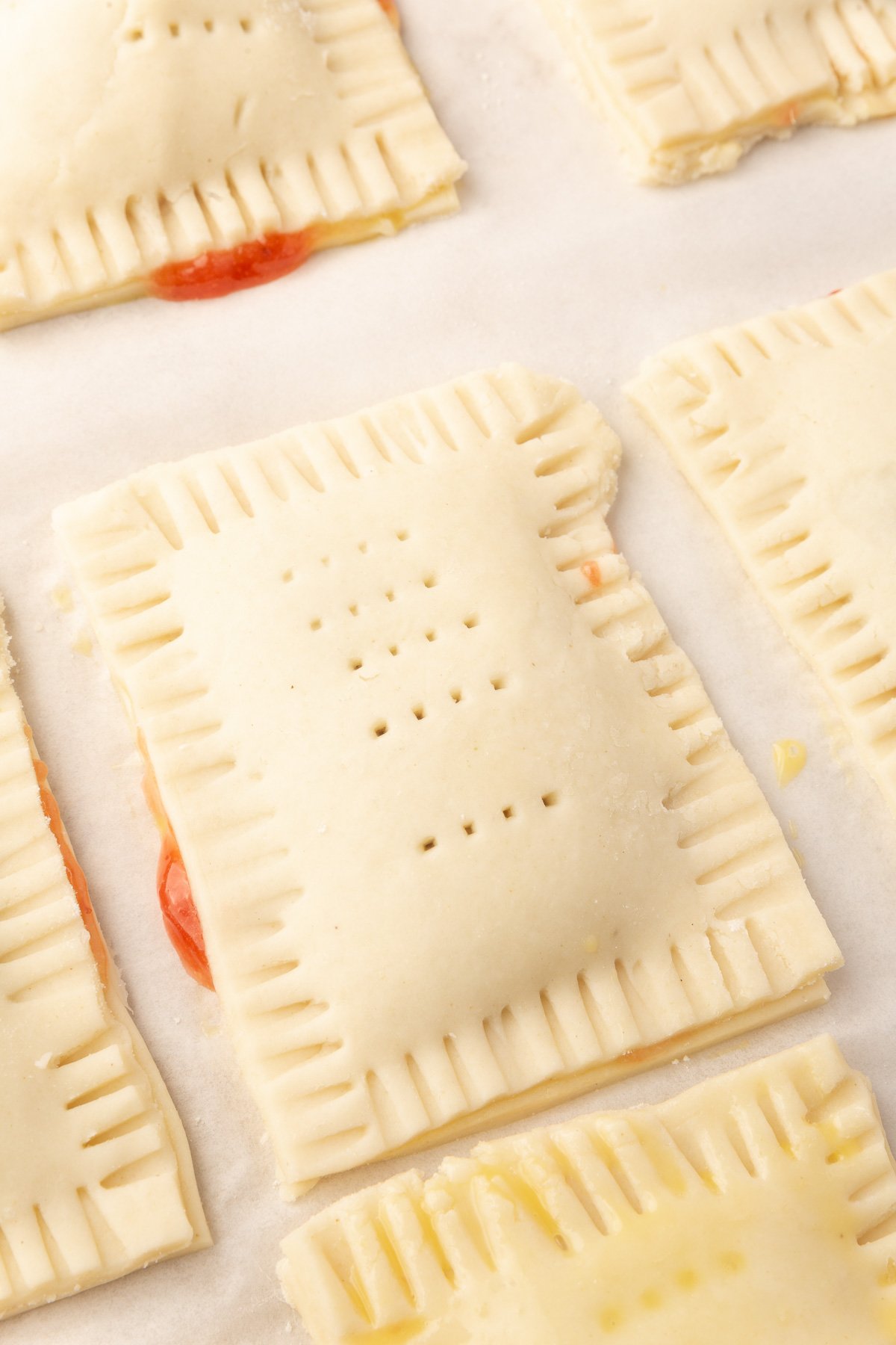 Close up image of uncooked pop tart on baking sheet.