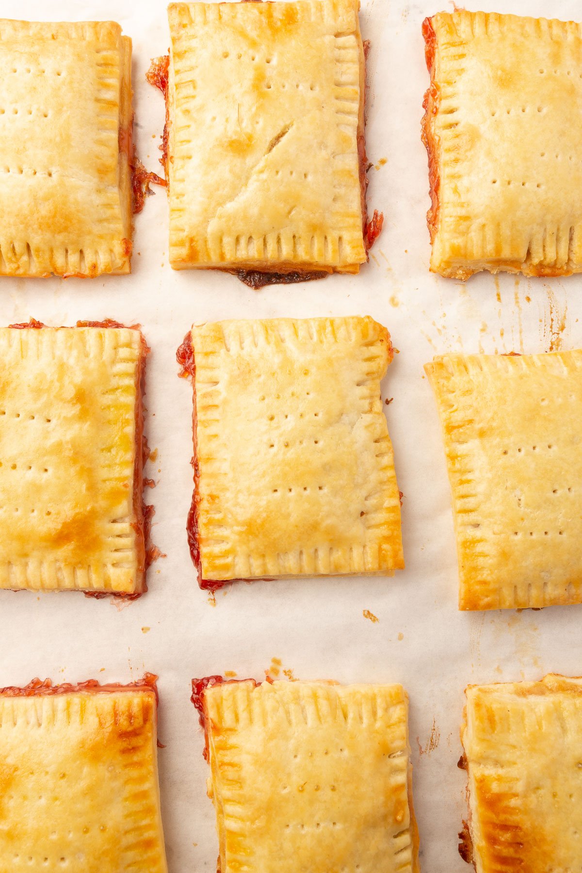 Image of baked pop tarts on baking sheet before frosting.