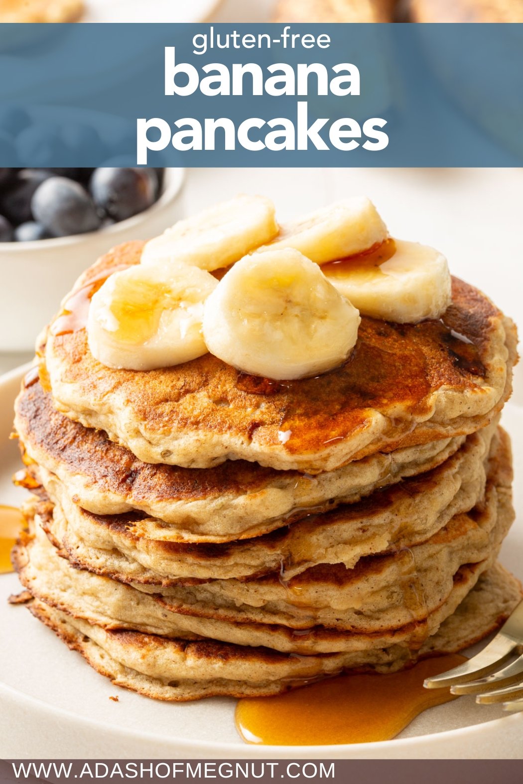 Stack of gluten-free banana pancakes topped with banana slices and syrup, with "gluten-free banana pancakes" in bold white text on a blue background and "www.adashofmegnut.com" at the bottom.