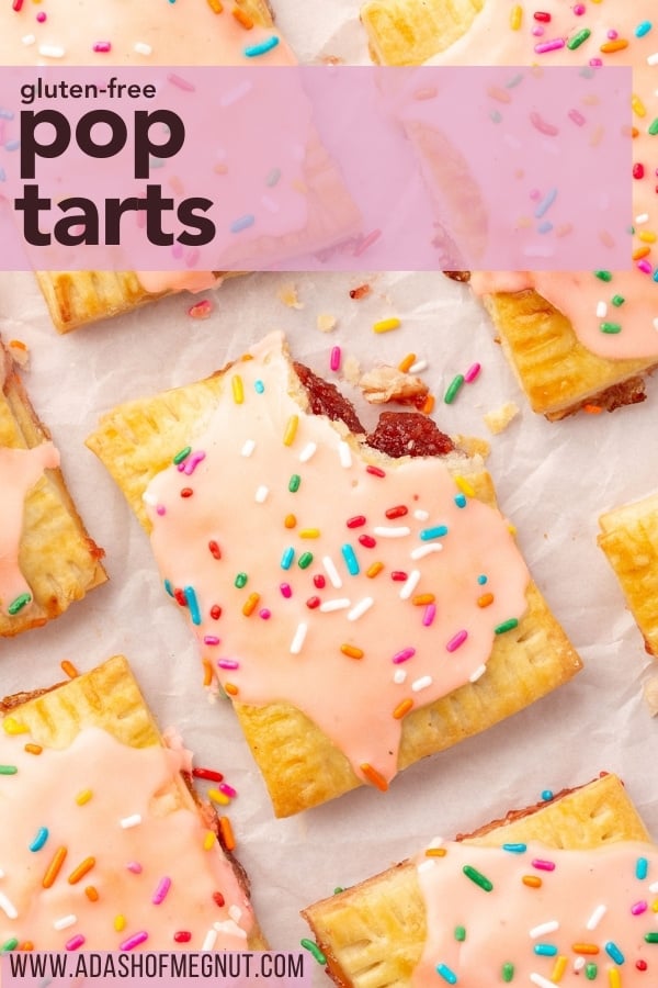 Gluten-free pop tarts with pink icing and colorful sprinkles on parchment paper. One has a bite taken out, revealing red jam filling. A pink banner at the top says 'gluten-free pop tarts.'