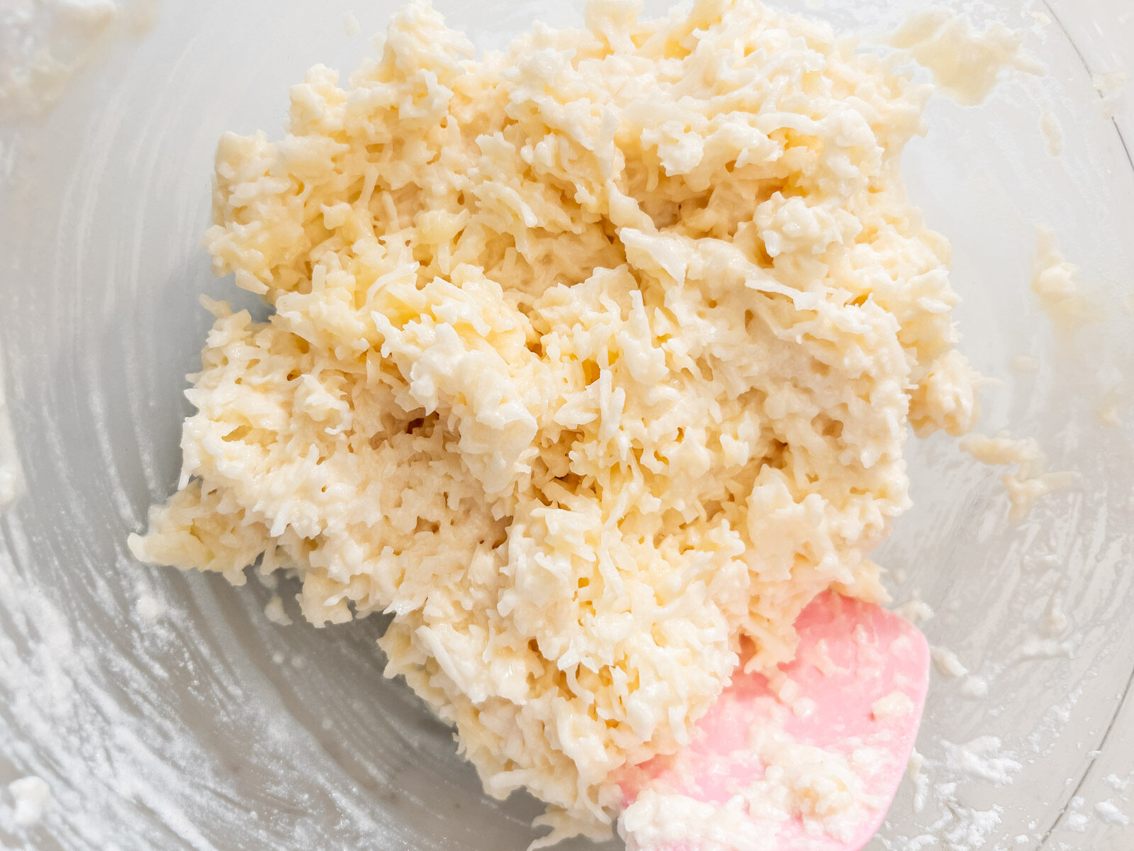 Coconut macaroon batter fully mixed with whipped egg whites folded in.