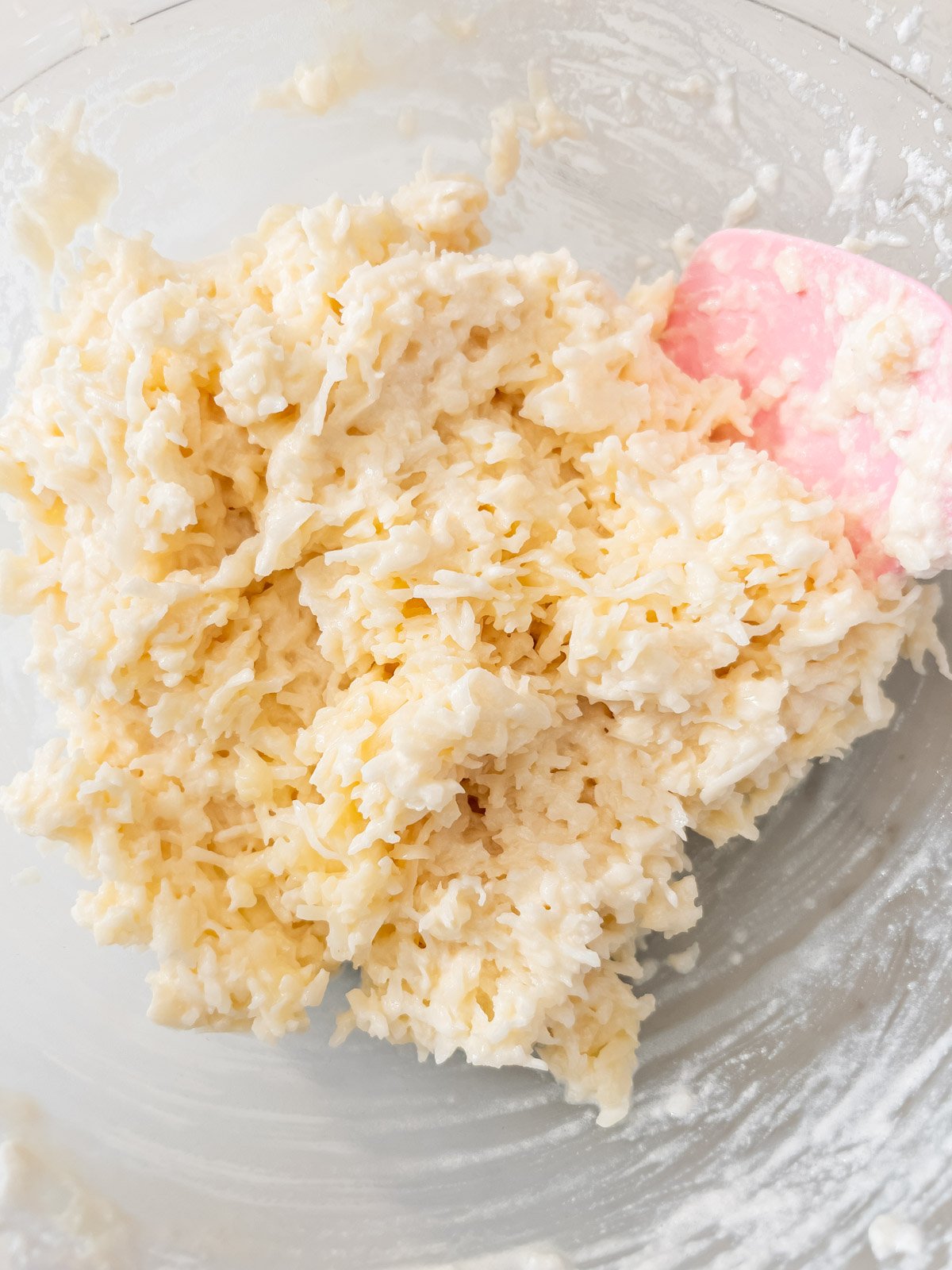 Coconut macaroon batter fully mixed with whipped egg whites folded in.