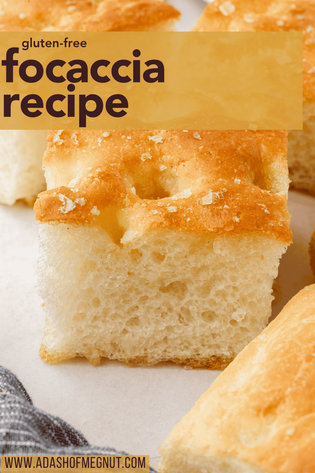 Soft, golden gluten-free focaccia sliced into cubes with sea salt flakes on top and text overlay reading gluten-free focaccia recipe.