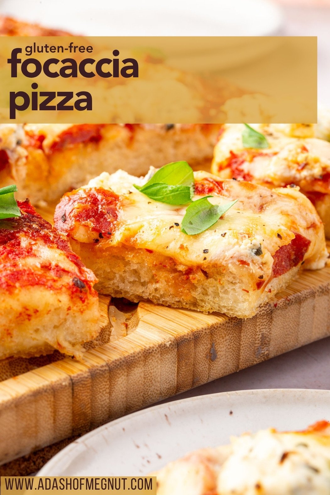 Side view of gluten-free focaccia pizza slice with text overlay for Pinterest sharing.
