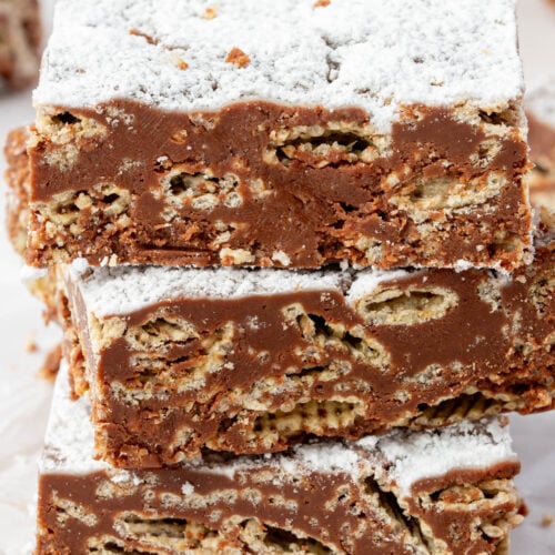 Close-up of puppy chow bar showing crispy Chex cereal coated in chocolate and peanut butter