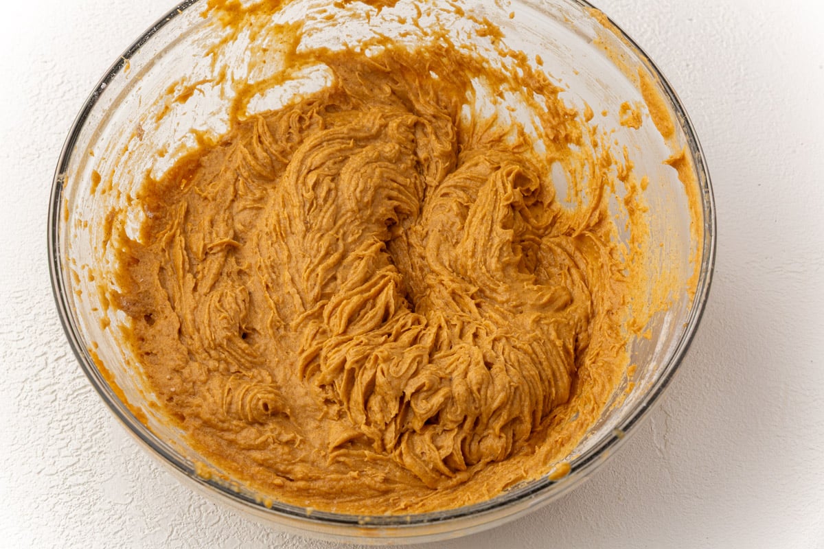 Thick pumpkin coffee cake batter fully mixed and ready to be spread into the pan.