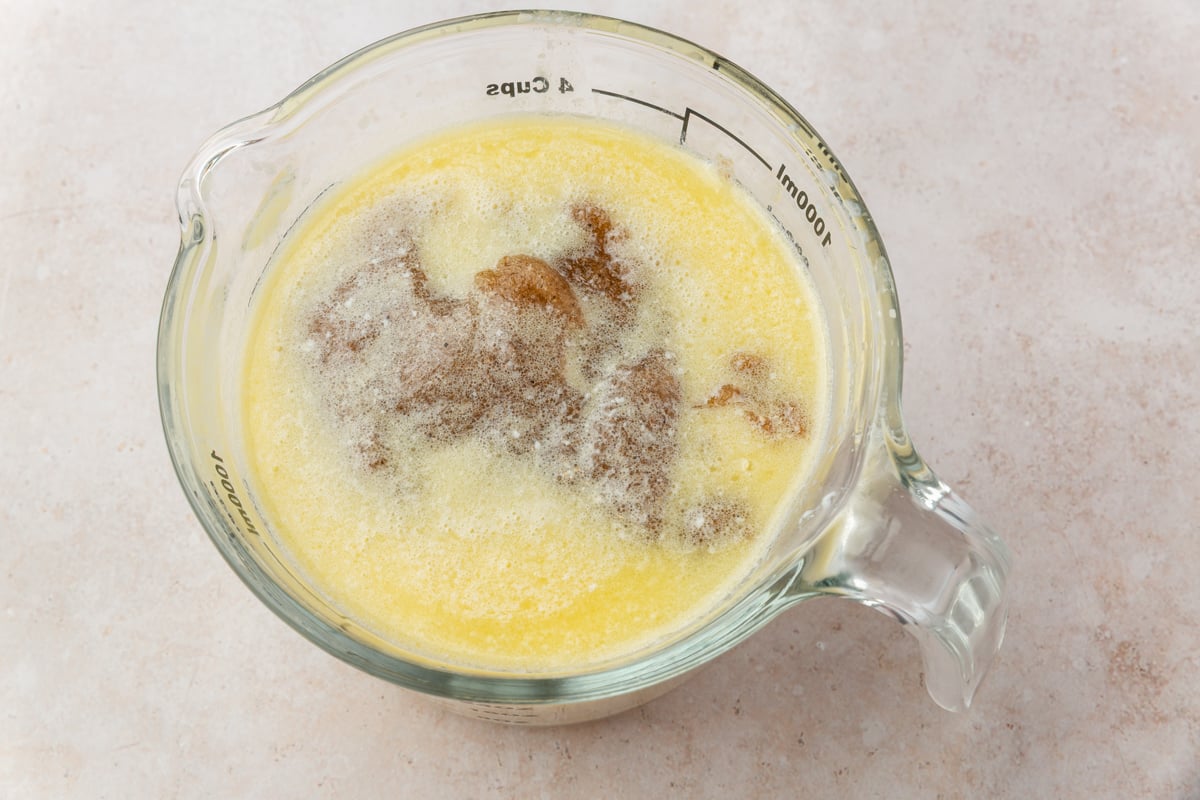 Glass measuring cup with melted butter and psyllium gel mixture for cinnamon rolls.
