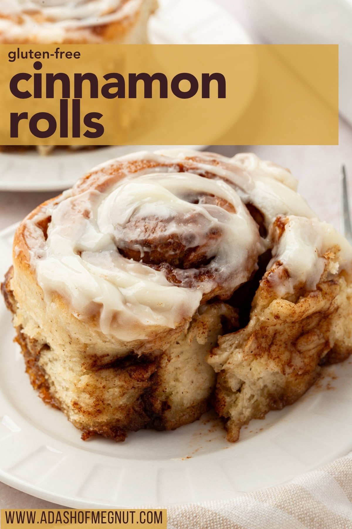 Pinterest graphic of a frosted gluten-free cinnamon roll with text overlay reading “gluten free cinnamon rolls” and website URL.