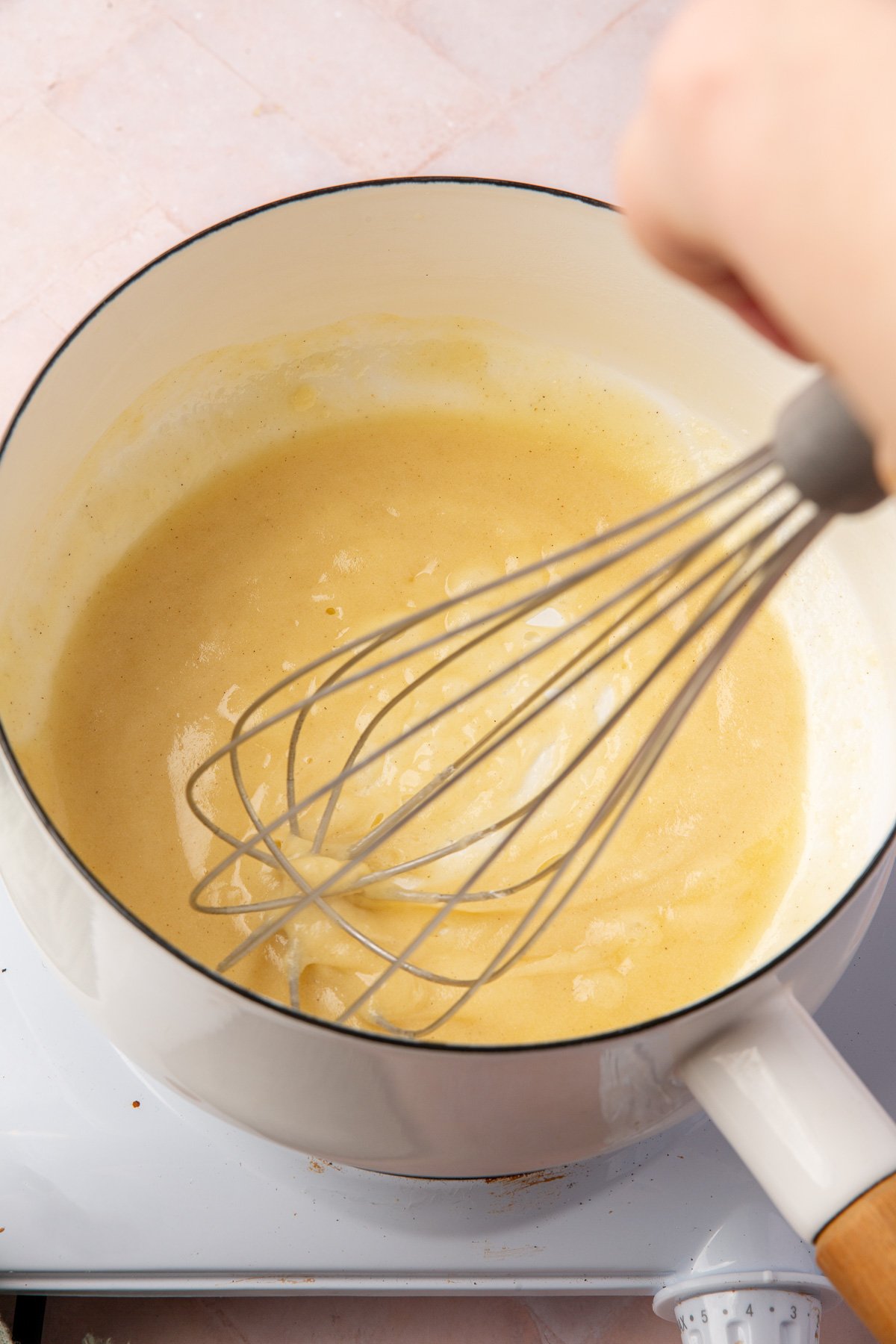 Whisk mixing butter and flour together into a smooth gluten-free roux.