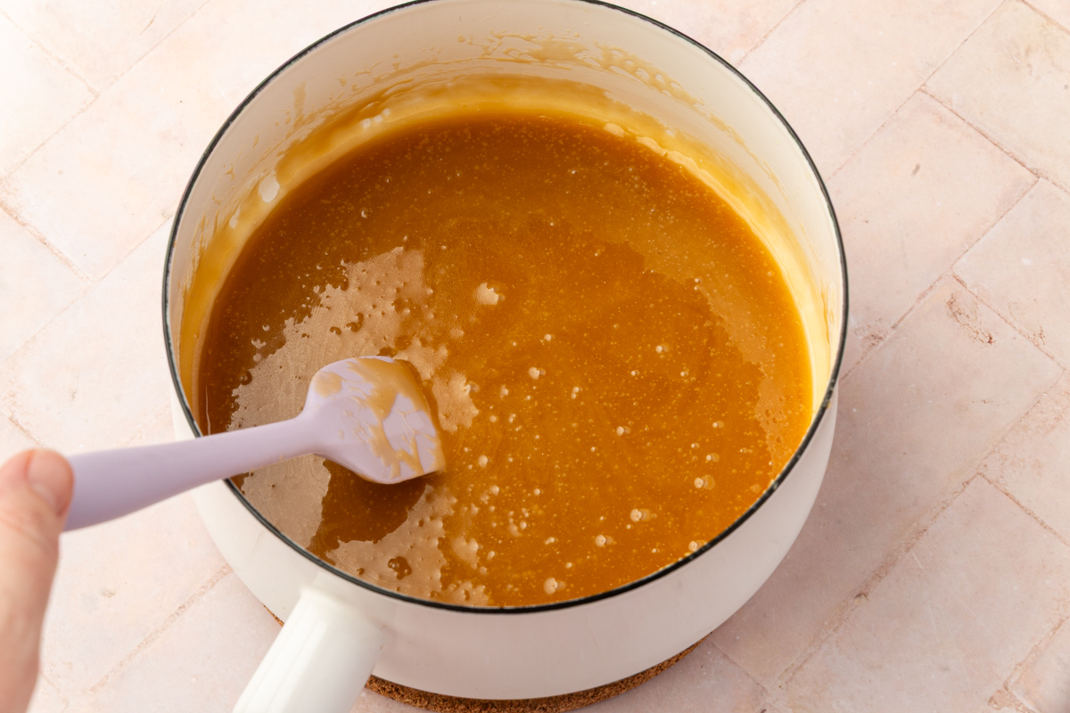 Smooth golden caramel sauce in saucepan after boiling butter and brown sugar for 3 minutes.