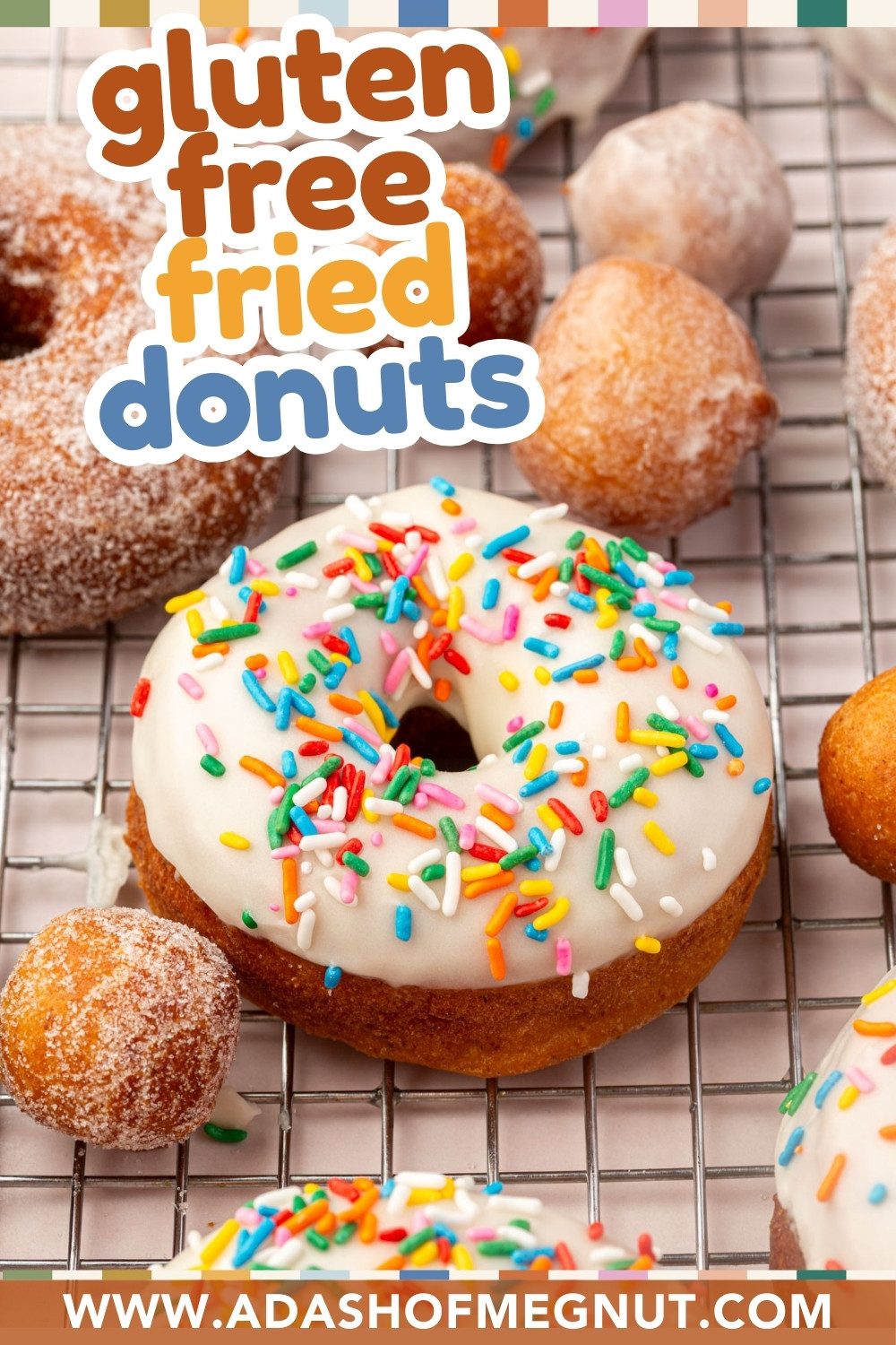 A wire rack with gluten-free fried donuts, some topped with white icing and colorful sprinkles, others coated in sugar. Text reads “gluten free fried donuts” and “www.adashofmegnut.com.”.