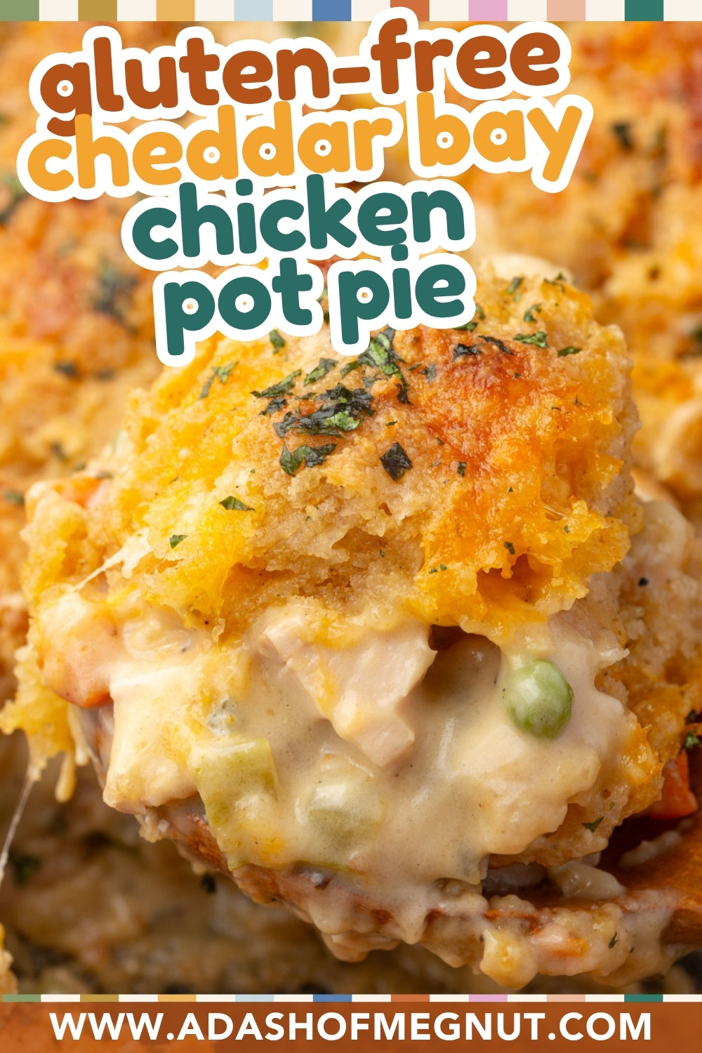 A close-up of a creamy chicken pot pie with vegetables, topped with a golden gluten-free cheddar biscuit crust. Text overlay reads “gluten-free cheddar bay chicken pot pie” and “www.adashofmegnut.com.”.