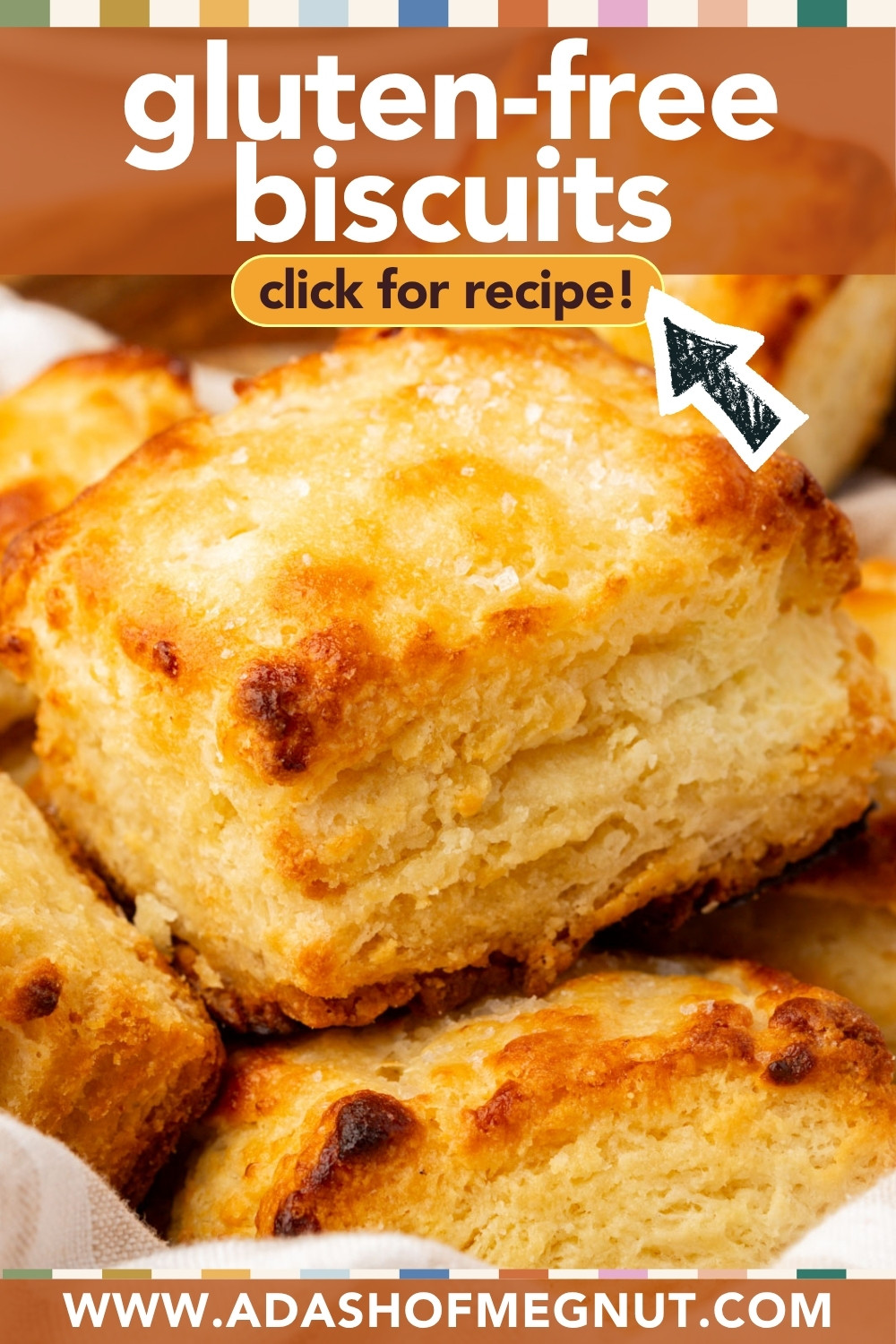 Close-up of golden, flaky gluten-free biscuits stacked together. Text on the image reads gluten-free biscuits, click for recipe! with a website link at the bottom: www.adashofmegnut.com.