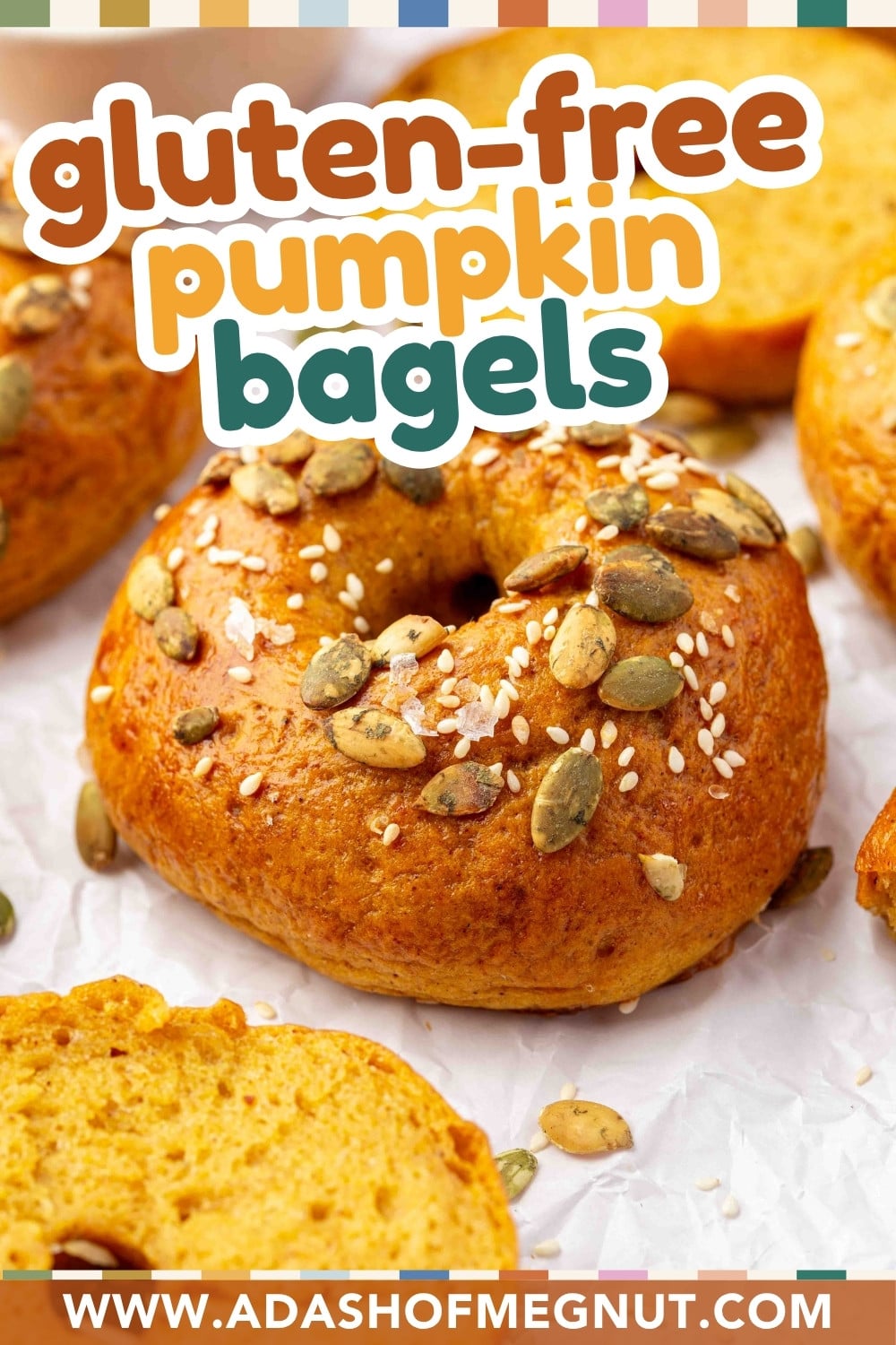 A pumpkin bagel topped with pumpkin seeds and sesame seeds, with the text gluten-free pumpkin bagels overlaid above and the website address below.