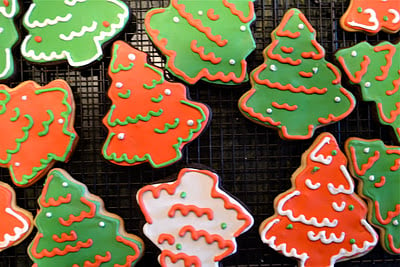 Christmas tree sugar cookies on a cooling rack. 